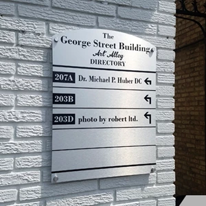 Contour cut Anodized Brushed Aluminum Sign as a Directional Exterior Sign, mounted with Decorative Stand-offs.