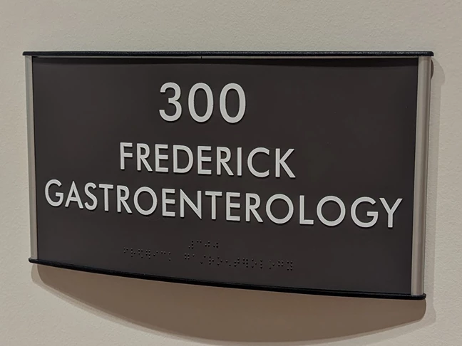 ADA Suite Sign with Curved Frame
